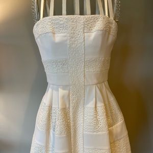 BCBG size 2 structured mini dress. Can be worn strapless. Side pockets Like new